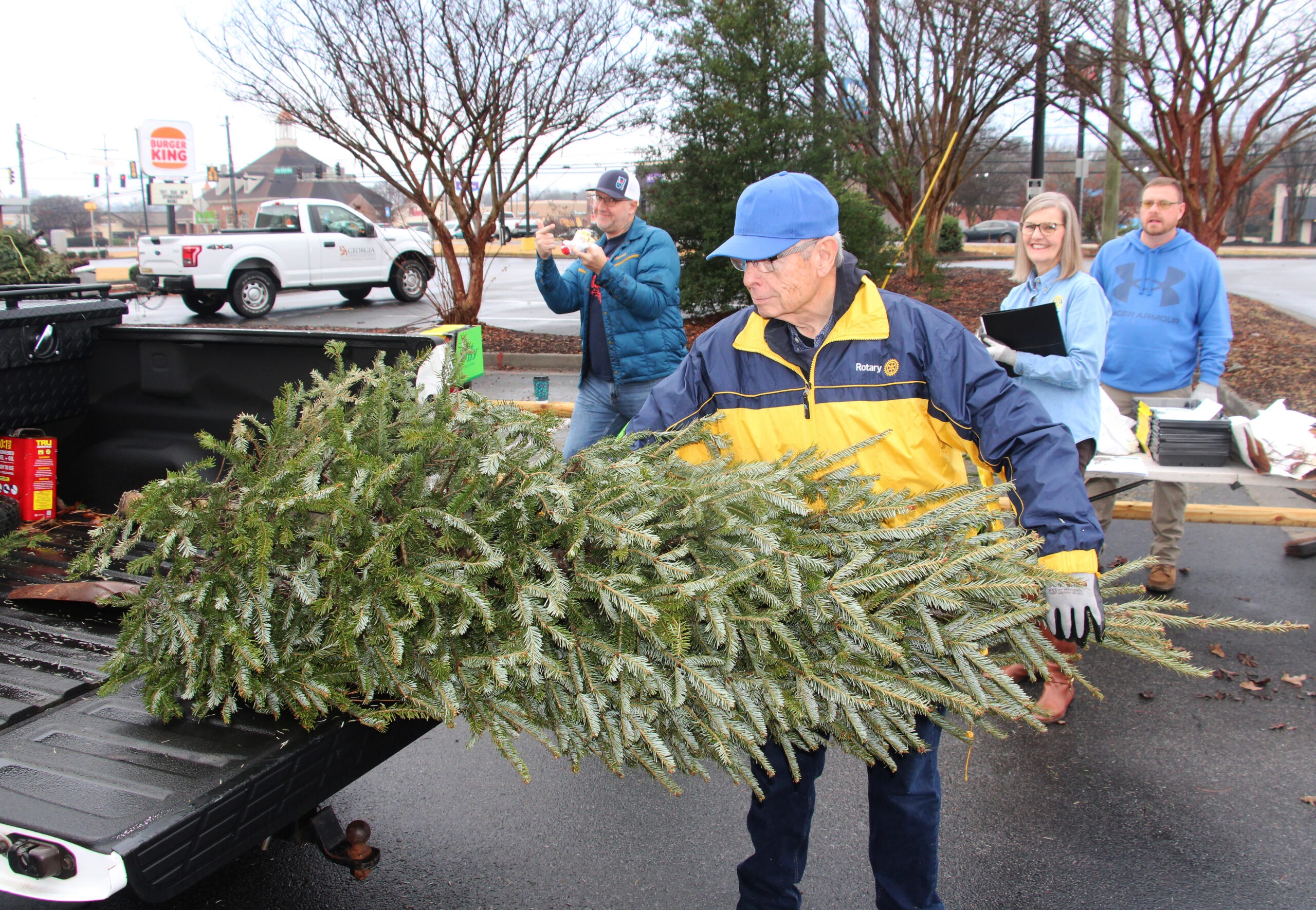 Members of Rome Rotary joined forced with Keep Rome Floyd Beautiful and the Georgia Department of Natural Resources to recycle Christmas trees as fish attractors in a couple of local DNR Public Fishing Areas.. The Rocky Mountain PFAS lakes got two flatbeds of trees while the Arrowhead PFA got one load. It’s the first time Rotary and DNR have joined KRFB for the annual Bring One for the Chipper campaign. Rome KRFB is celebrating it’s 50th anniversary this year.